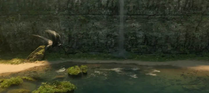 Un dragon qui plonge dans un lac au pied d’une cascade